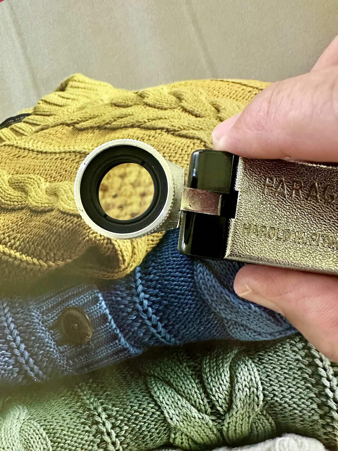 A loupe examining catalog print detail