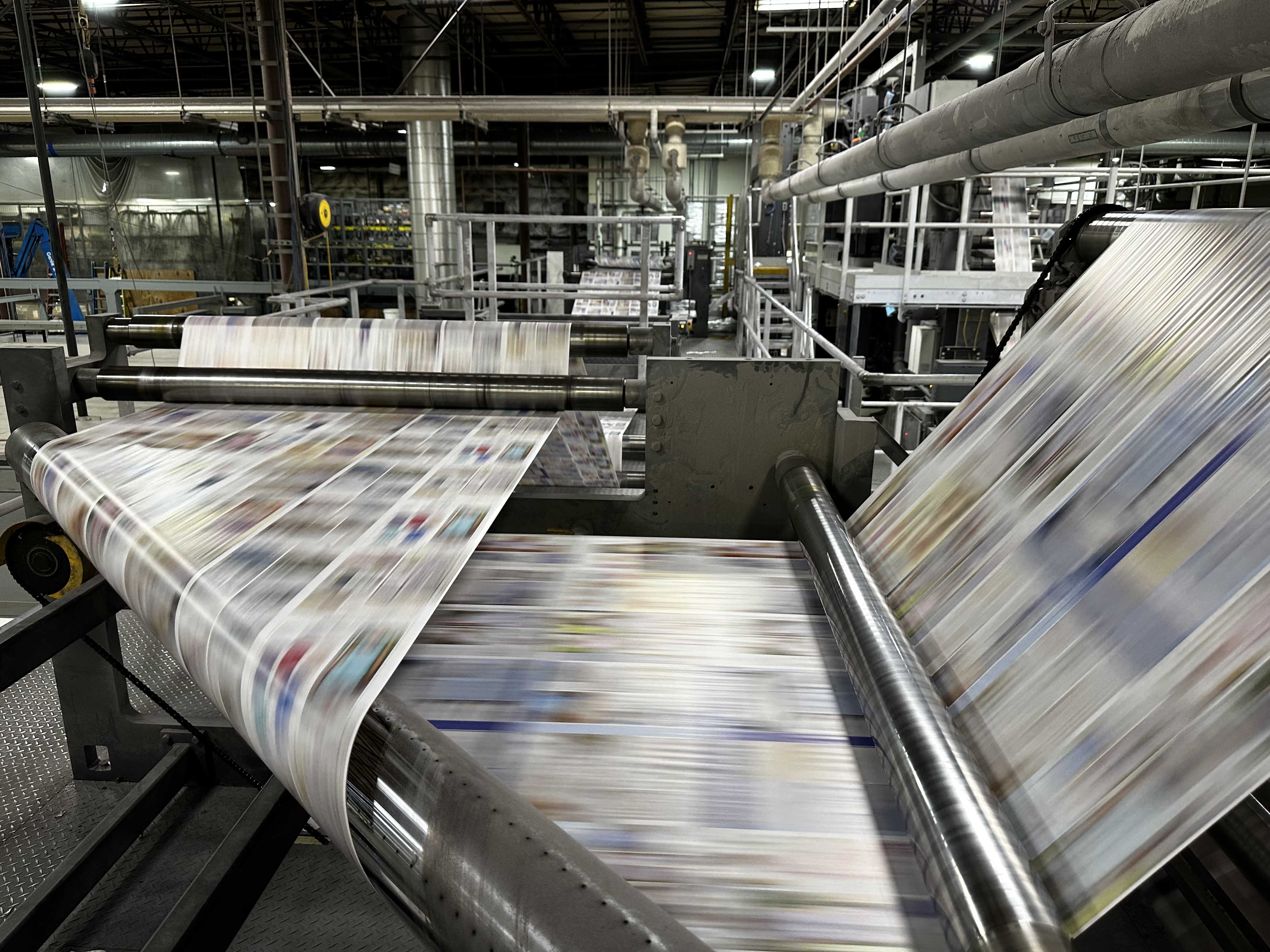 Web printing press running a catalog job